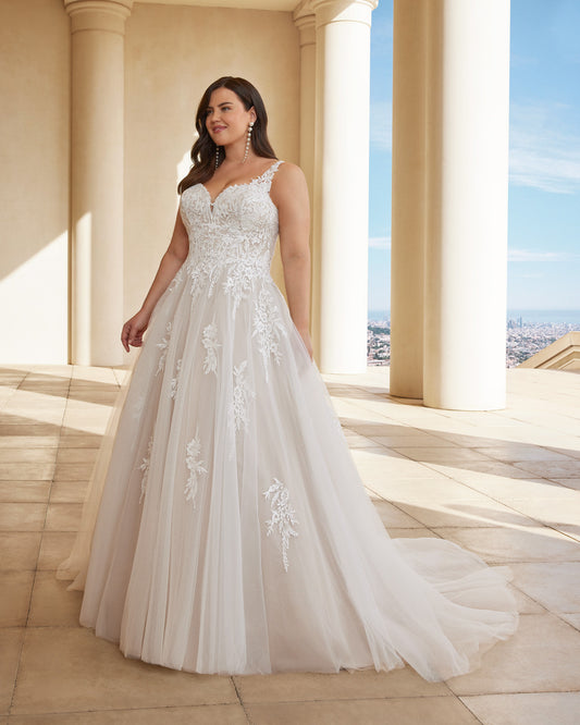 Plus size boho wedding dress with V-neckline and lace appliqué over tulle