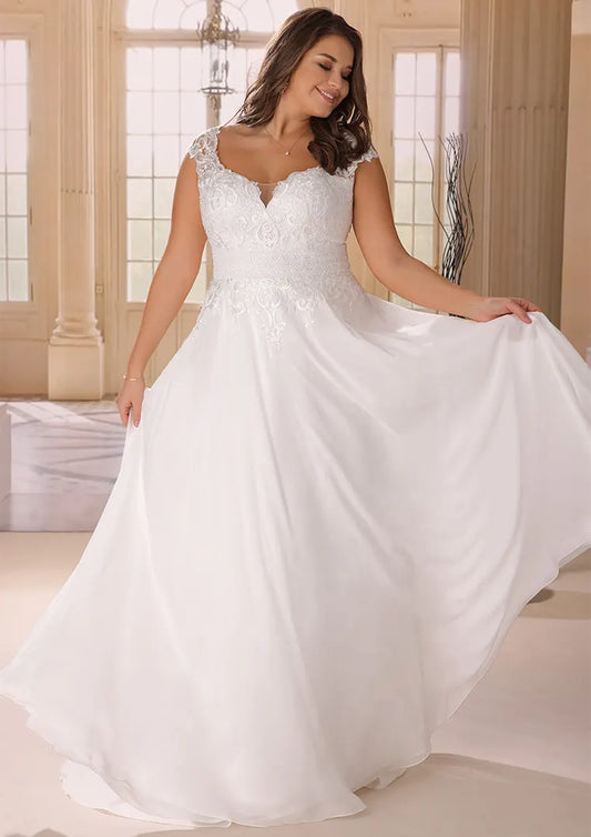 Plus size chiffon A-line wedding dress with lace bodice and flowing skirt