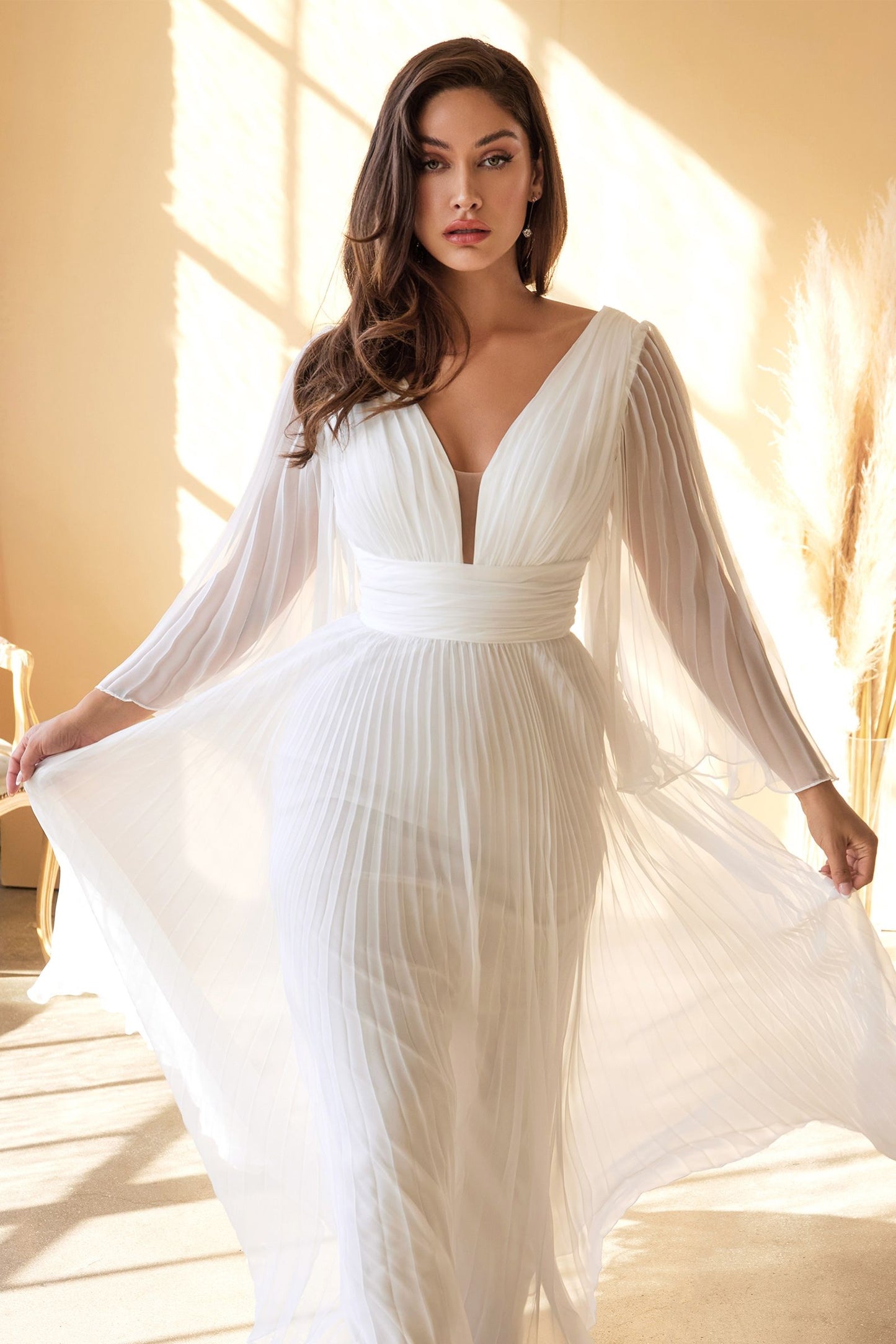 Closeup of ruched bodice and V-neckline on plus size wedding gown