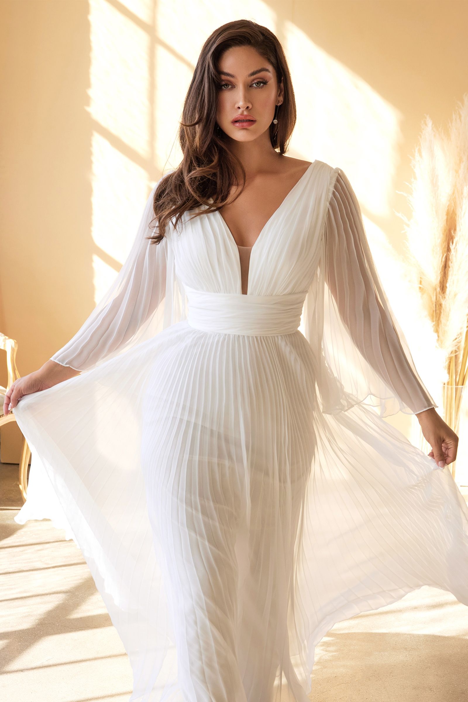Closeup of ruched bodice and V-neckline on plus size wedding gown