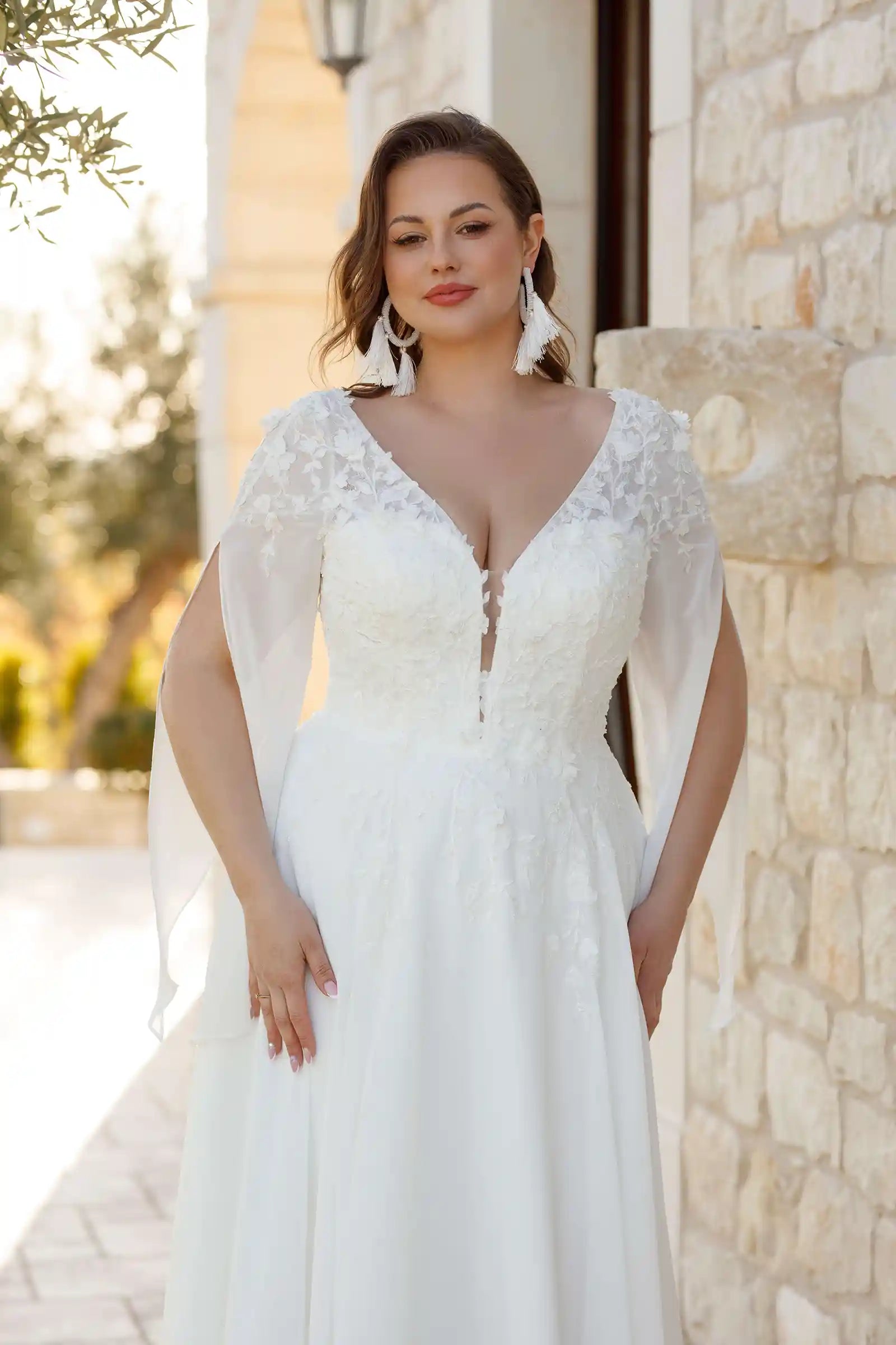 Flowing chiffon sleeve detail on plus size bridal gown