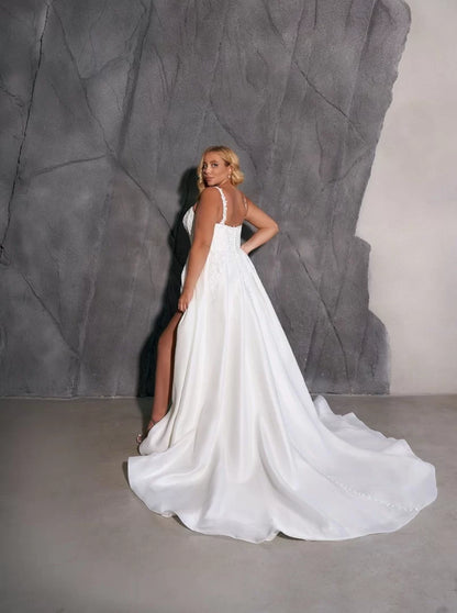 Full-length satin wedding dress for plus size bride
