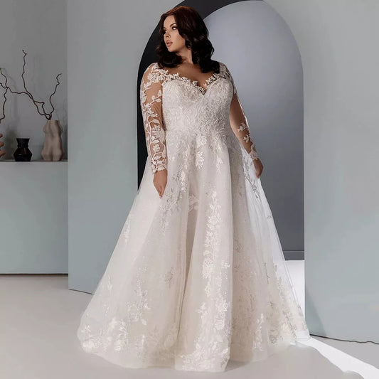 Sparkly plus size A-line wedding dress with tulle layers and soft shimmer