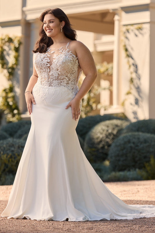 Front view of plus size ivory mermaid wedding dress with lace bodice