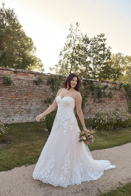Back view of lace A-line bridal gown with sweeping train