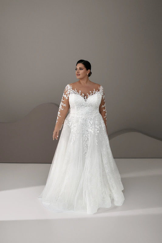 Front view of plus size lace wedding dress with illusion neckline

