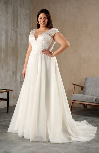 Front view of plus size lace wedding dress with cap sleeves and V-neckline