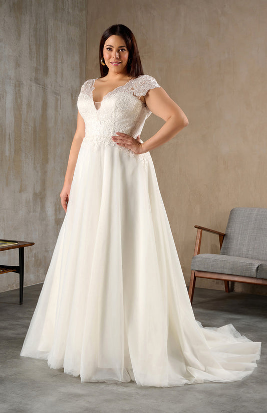 Front view of plus size lace wedding dress with cap sleeves and V-neckline