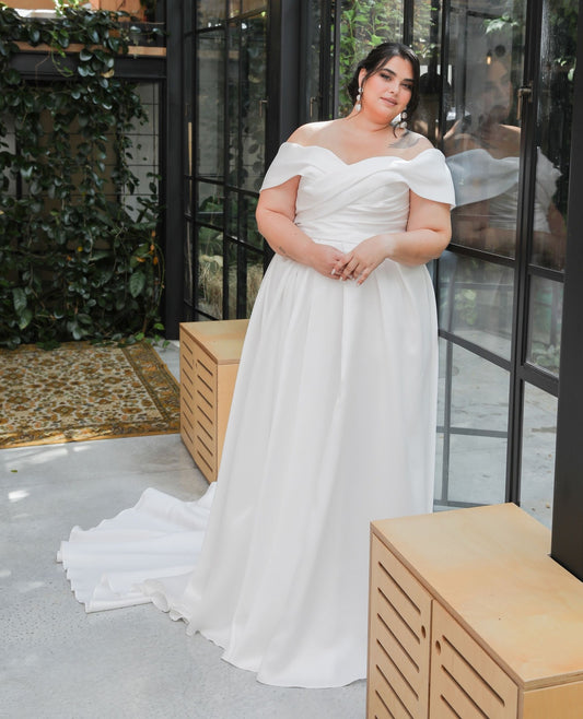 Off-shoulder satin A-line wedding dress with V-neck for plus size bride