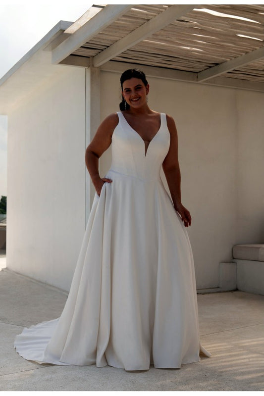 Plus-size satin A-line wedding dress with deep V-neck and wide straps, featuring minimalist elegance

