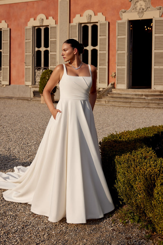 Plus size satin wedding dress with square neckline and A-line silhouette for elegant brides