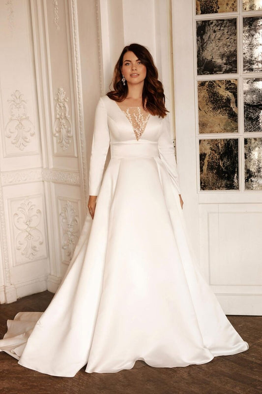 Plus size satin wedding dress with long sleeves and timeless silhouette