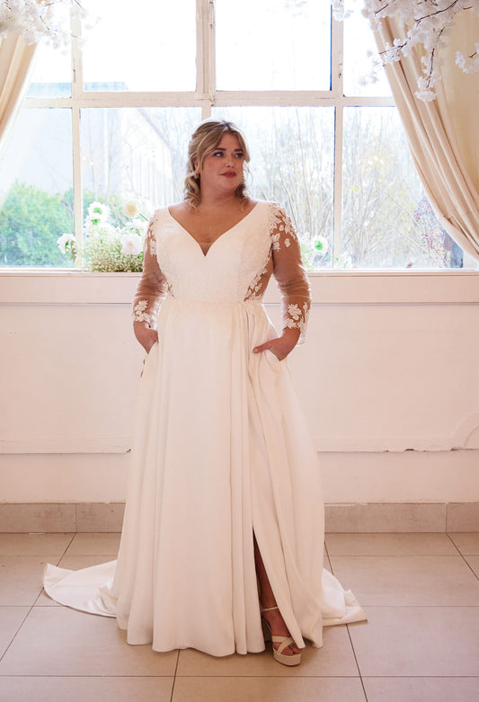 Plus-size vintage satin wedding dress with V-neckline and lace applique sleeves

