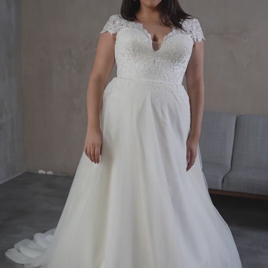 Elegant plus size wedding dress styled for modern brides
