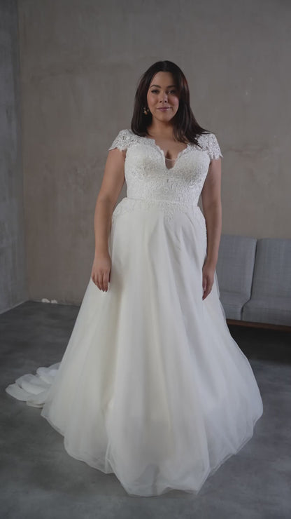 Elegant plus size wedding dress styled for modern brides