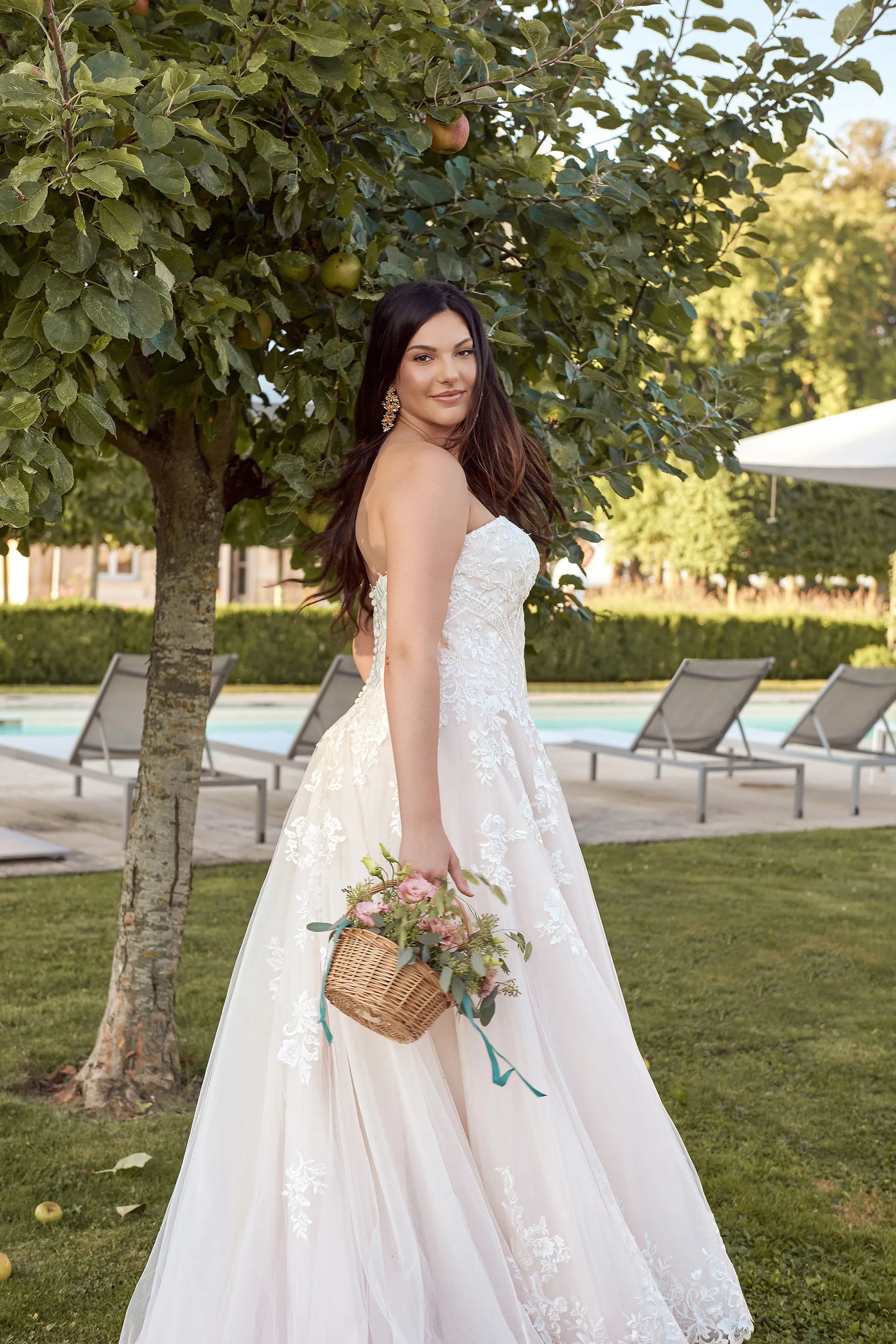 Plus size bride in romantic strapless A-line gown