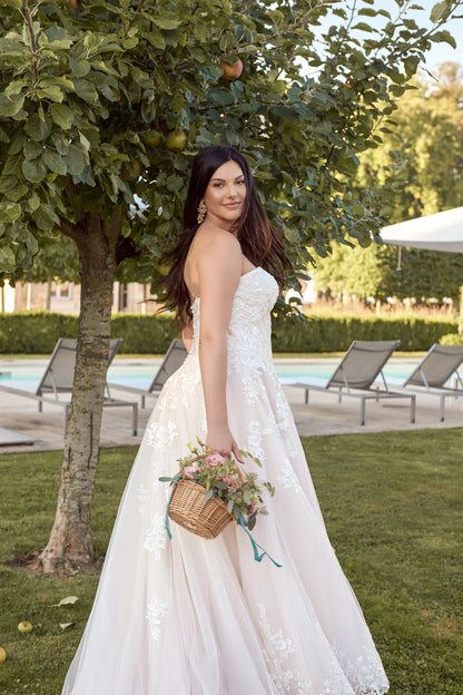 Plus size bride in romantic strapless A-line gown