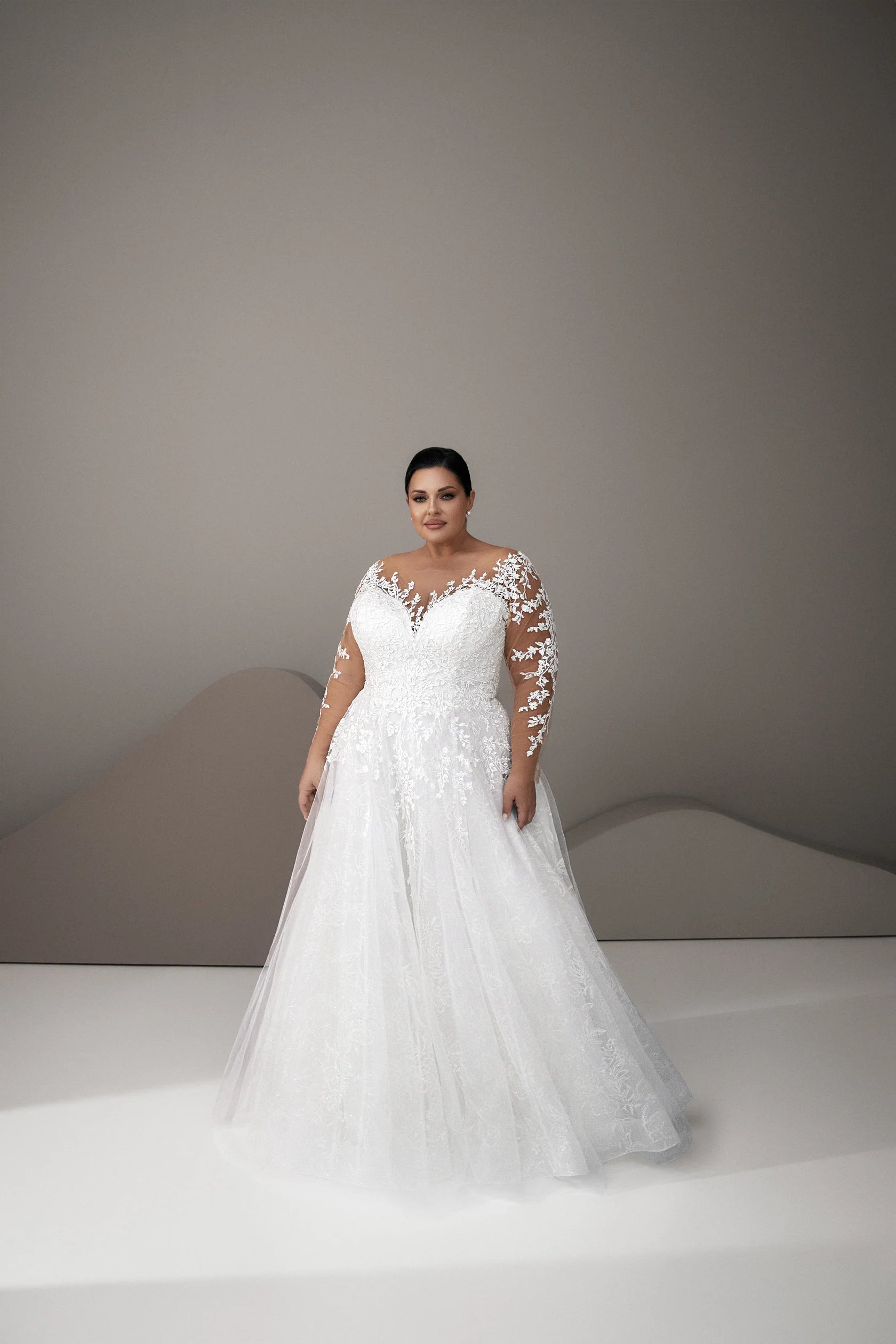 Romantic lace plus size wedding dress with flowing tulle skirt