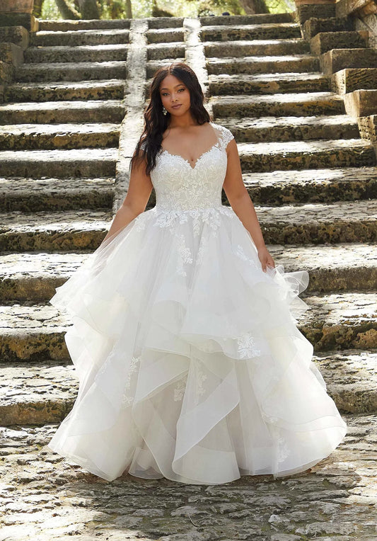 V-neck wedding dress with lace and cap sleeves