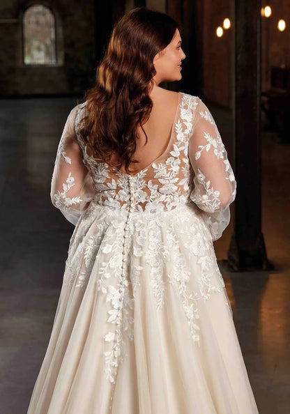 Close-up of floral lace applique and puff sleeve on curvy wedding gown