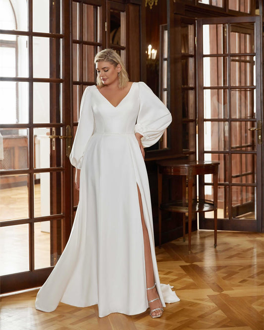 Romantic plus size satin wedding dress with soft puff sleeves