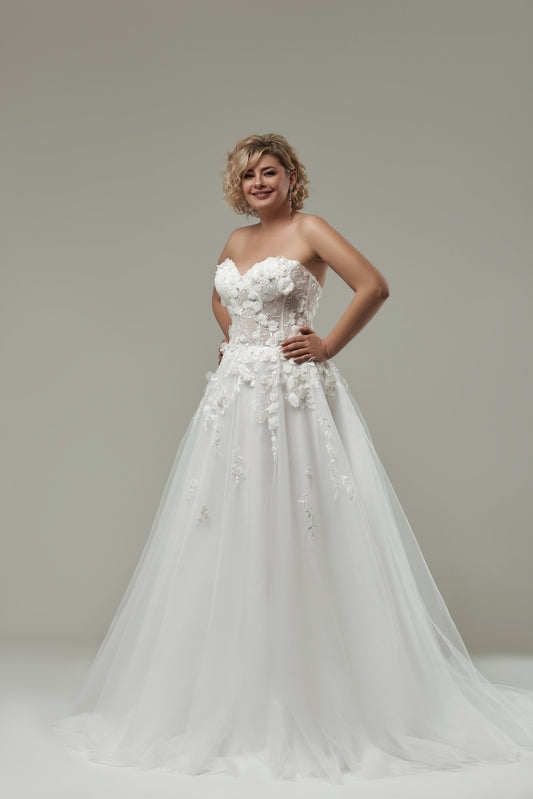 Strapless plus-size wedding dress featuring 3D floral appliqués and sweetheart neckline

