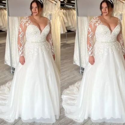 curvy bridal gown with deep v neckline and floral lace appliqué bodice

