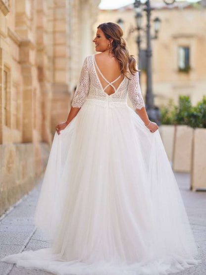 Front view of lace applique V-neck gown for full-figure bride